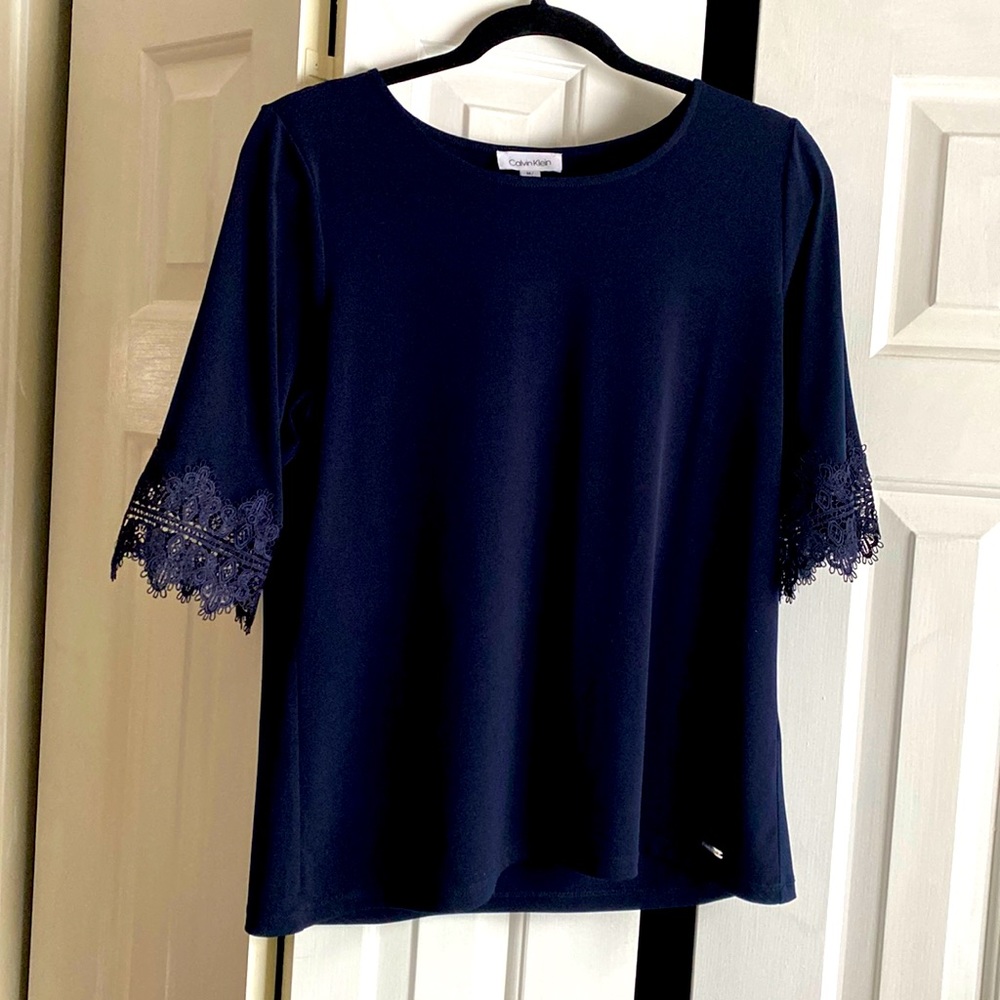 Calvin Klein navy blouse with lace sleeve details